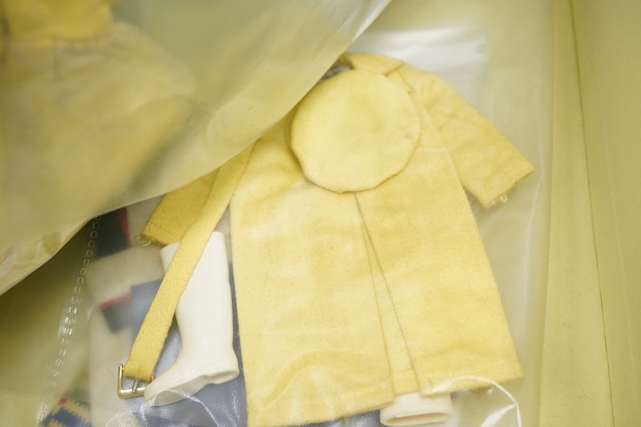 A 1960's Mattel Inc. Barbie doll, 1963, together with a Skipper doll, and a collection of eight original outfits with accessories, sorted into individual packets, outfits purchased between 1963 to 1966 include; American